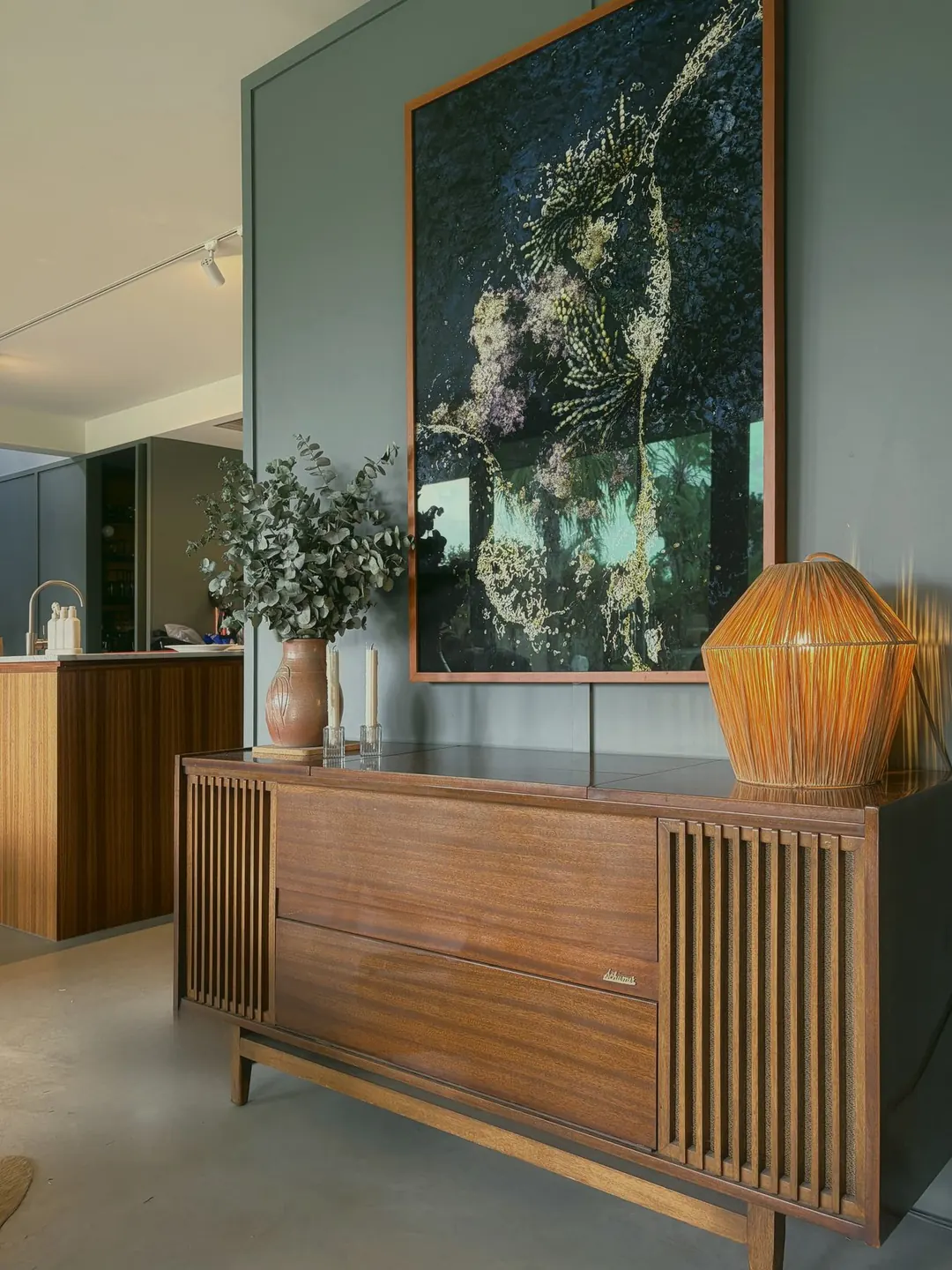 Radiogram sideboard with a large painting